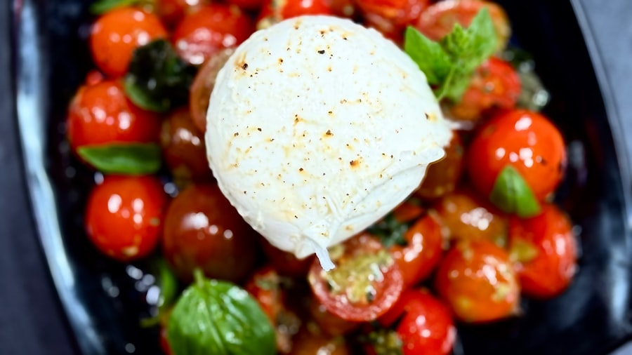 Burrata with cherry tomatoes and basil